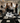 Elegant corporate workshop events option showing a group of women interacting around a table set for an illustration workshop in a stylish gallery.